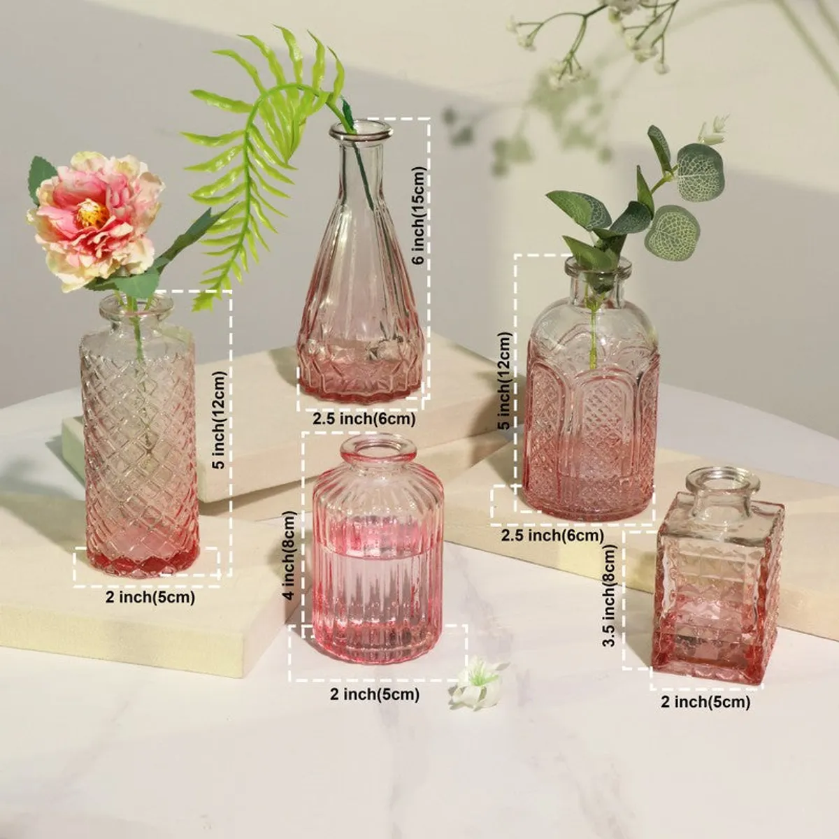 Pink glass vases with flowers and size markings shown in image