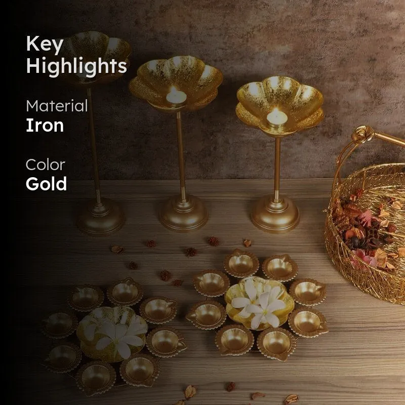Gold urli set styled on a table with candle stands and decor basket
