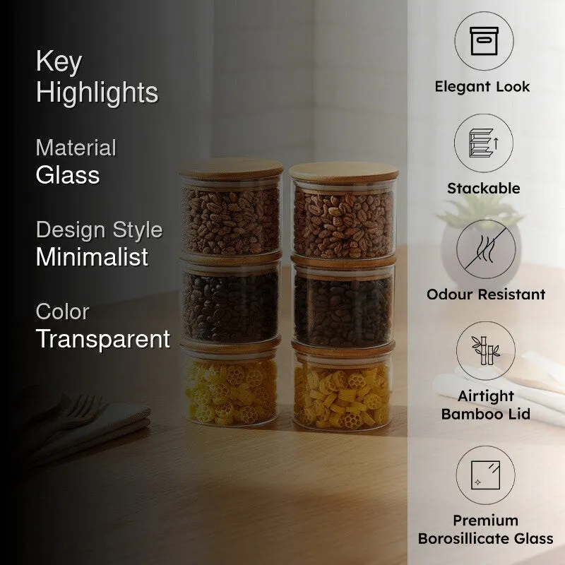 Six transparent glass jars with bamboo lids shown in a kitchen setting