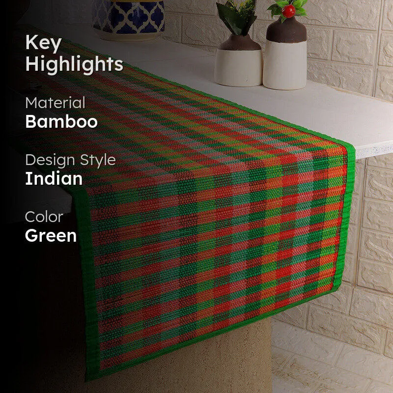 Green, red and orange checked table runner shown with material and colour highlights