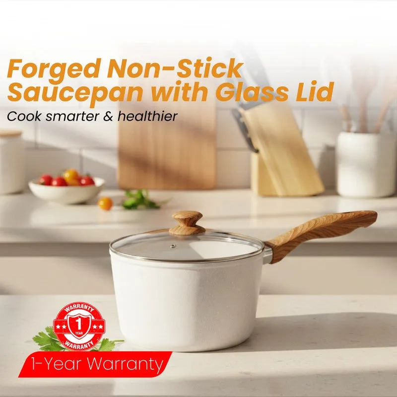 White saucepan with glass lid and wood-look handle styled on a kitchen counter