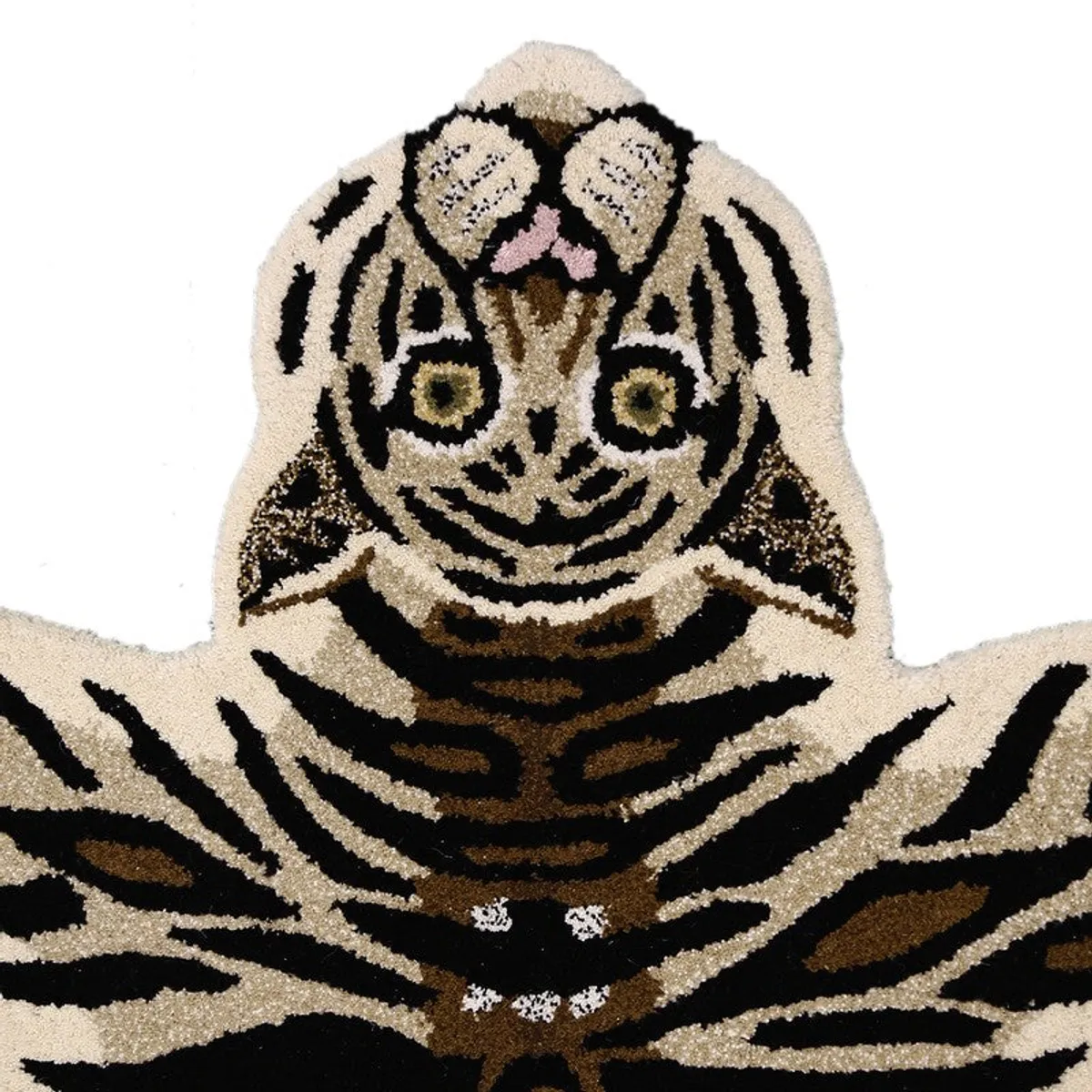 Close-up of the tiger face and striped plush pile