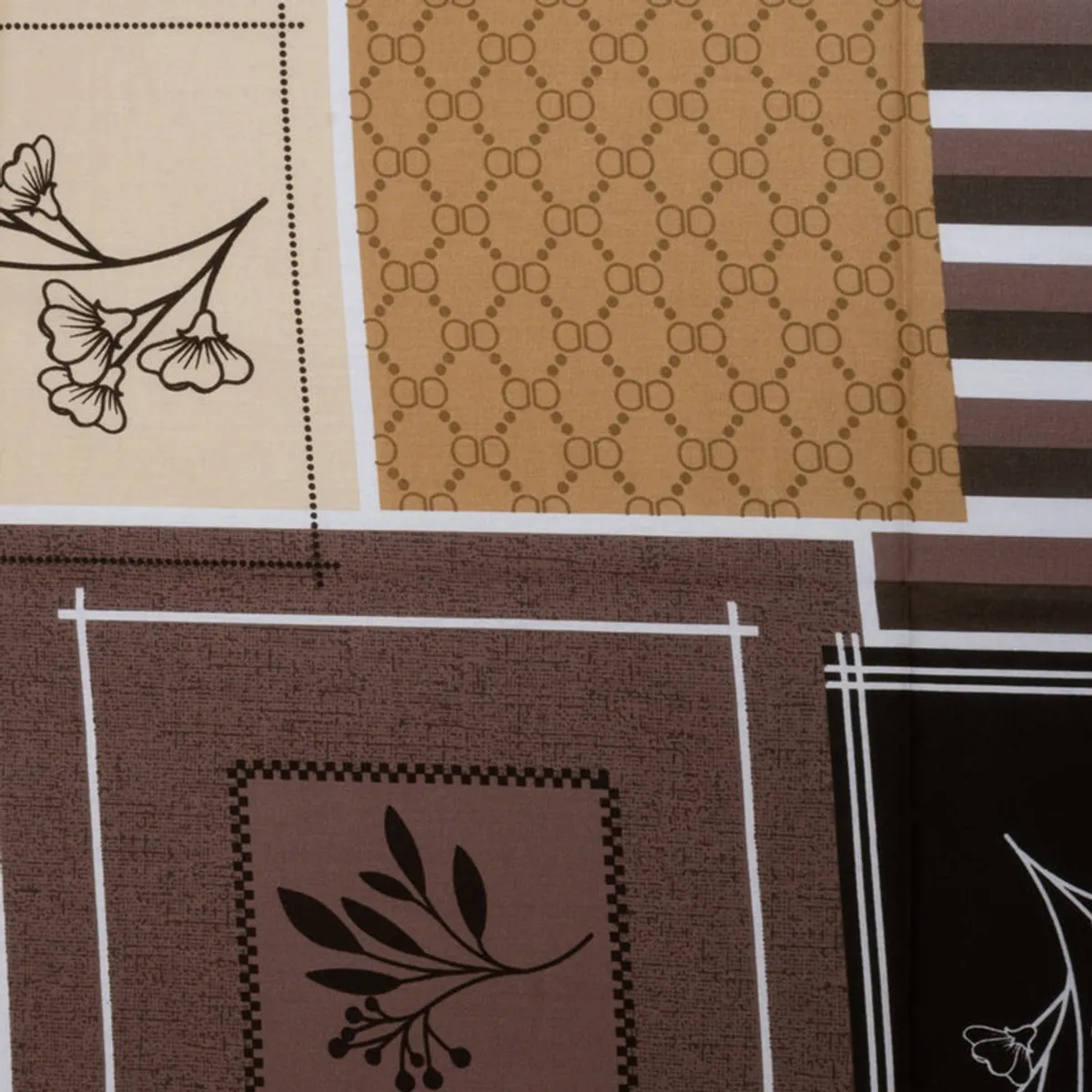 Close-up of geometric floral and striped bedsheet print in earthy tones