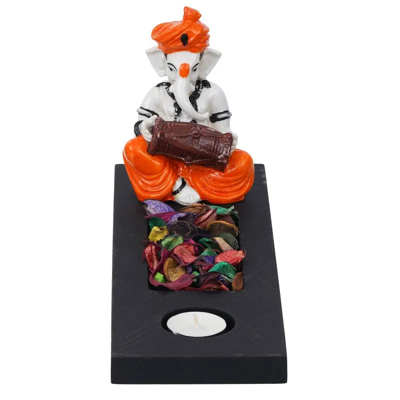 Front view of Ganesha tea light holder on a rectangular black base