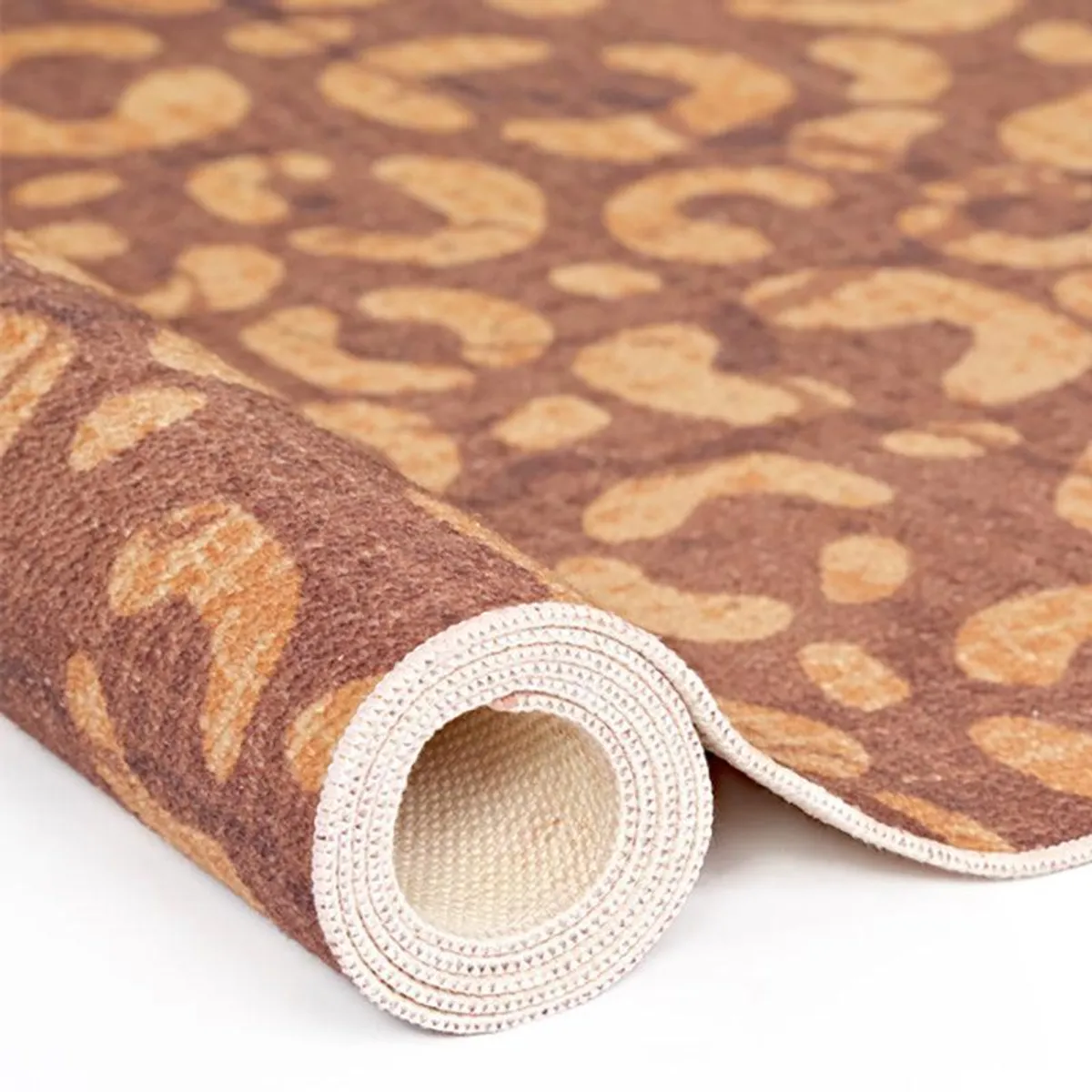 Rolled edge view showing the carpet surface and backing