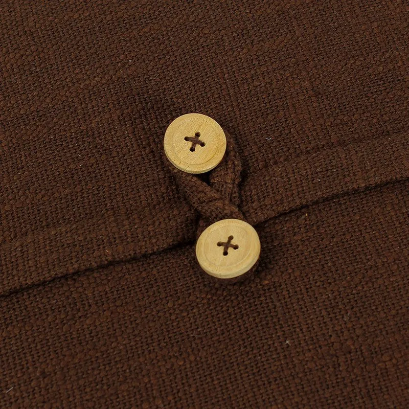 Close-up of the brown cushion cover with two wooden-look buttons