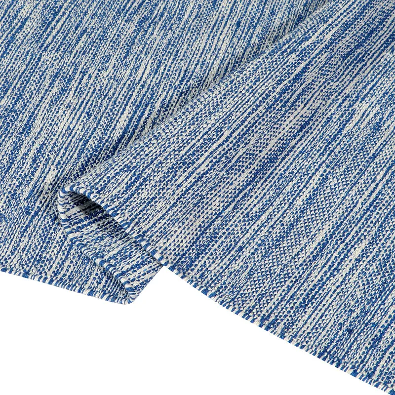 Close-up of the blue runner rug showing textured surface detail