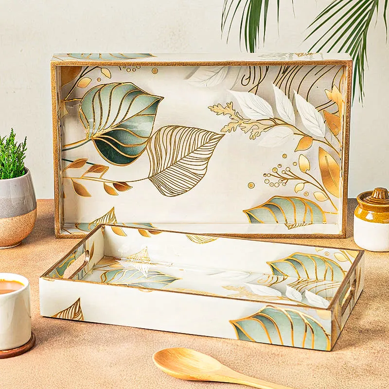 Set of two rectangular serving trays with botanical print in white, green and gold