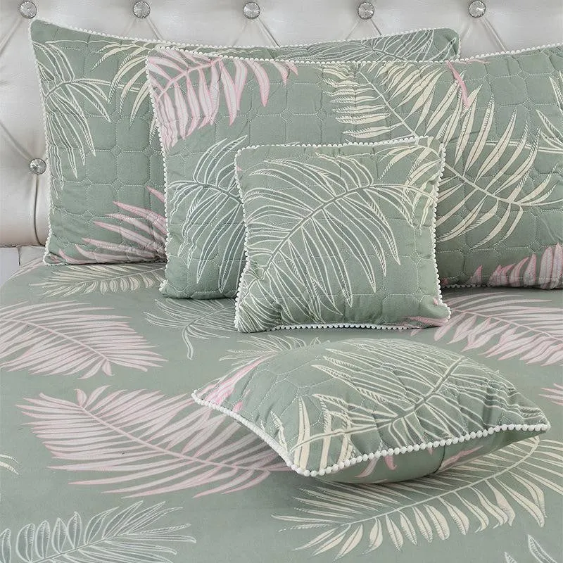 Matching pillows and cushions with leaf print and pompom lace edging