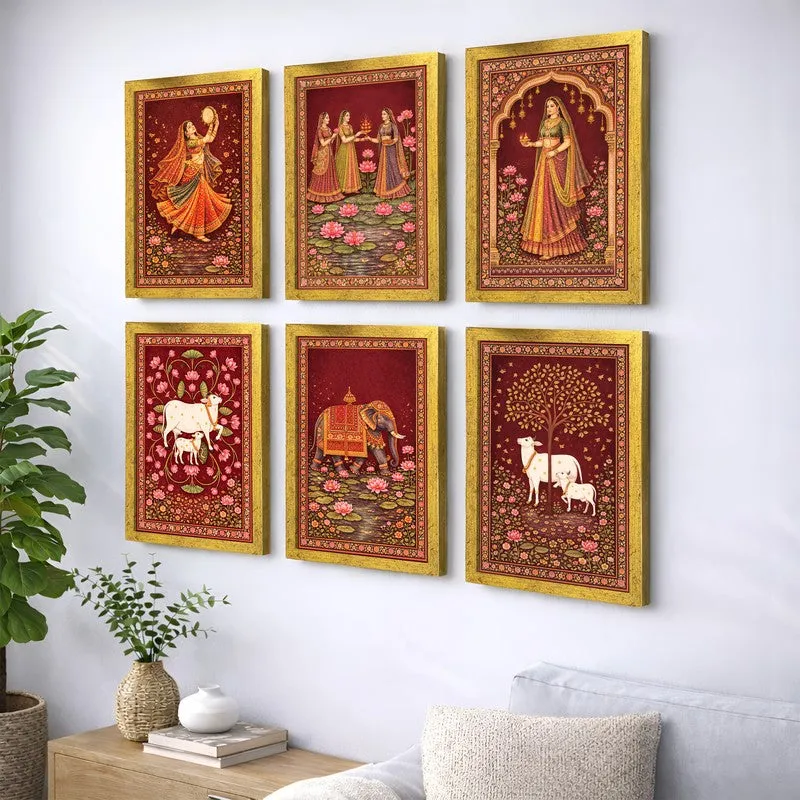 Angled view of six crimson and gold framed Indian art prints styled on a white wall