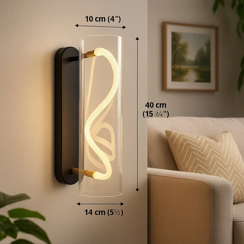 Close-up of the transparent wall lamp mounted on a wall beside a sofa