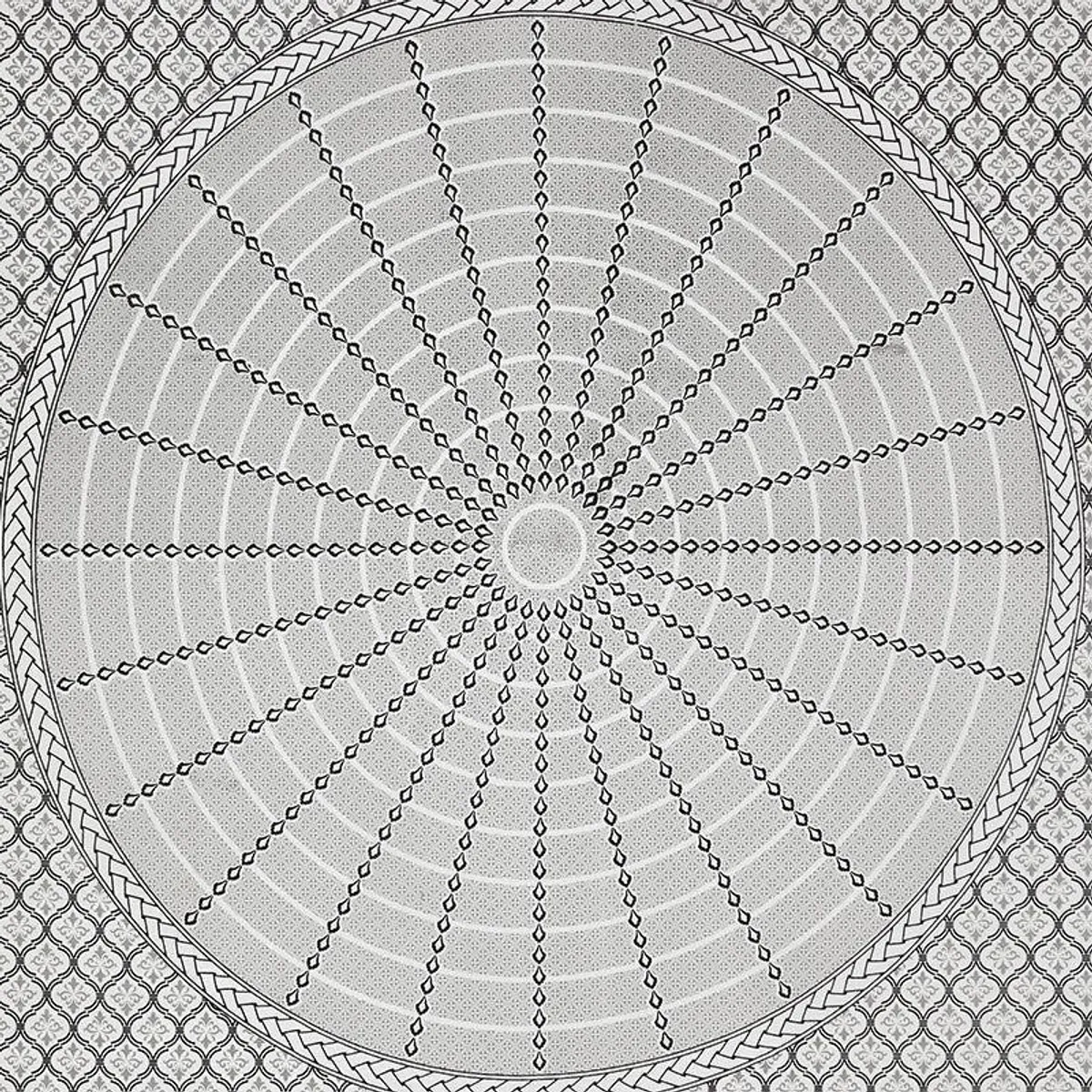 Close-up of the printed bedsheet pattern in white and black