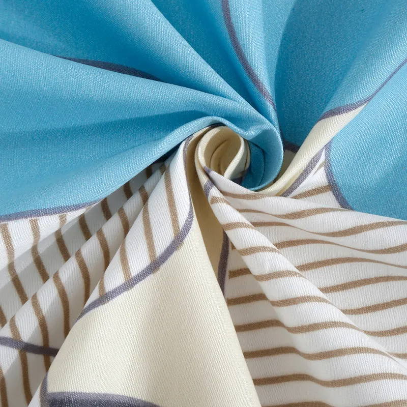 Close-up of blue and white bedsheet fabric with striped detail
