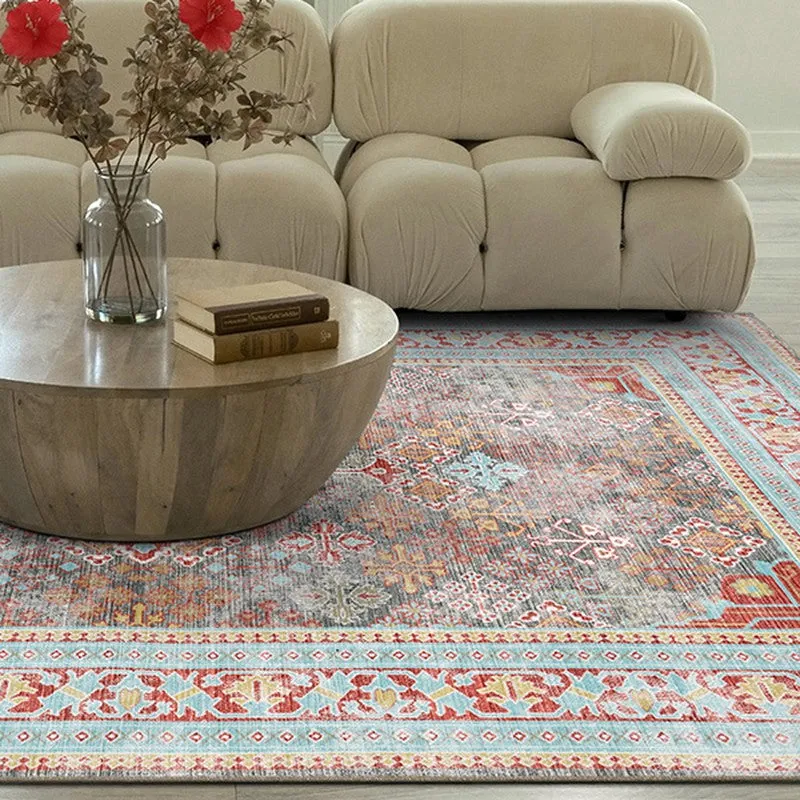 Close view of patterned carpet beside a sofa and round coffee table