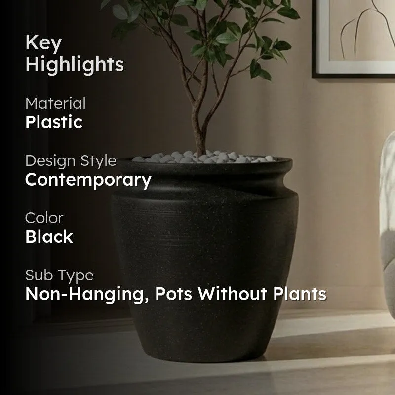 Black urn-shaped planter styled with a leafy indoor plant