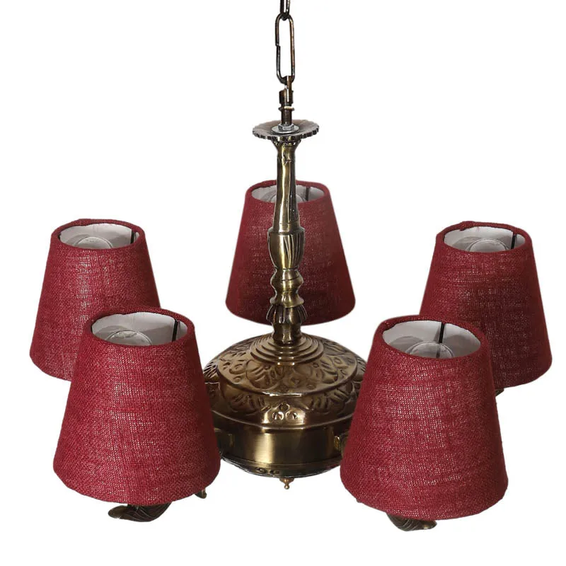 Top angled view of antique gold chandelier showing maroon conical shades