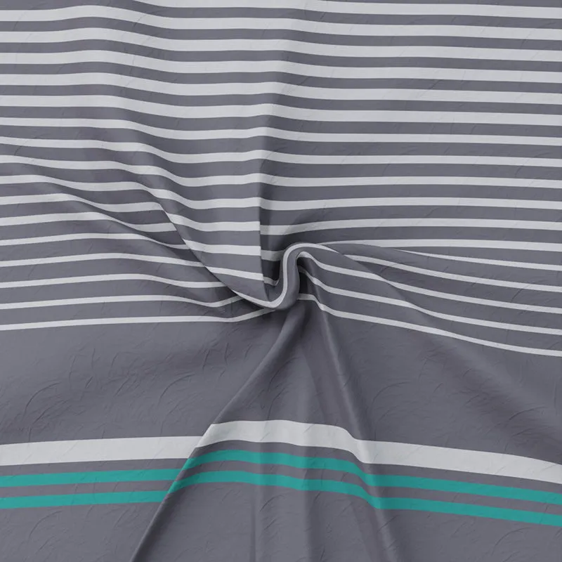 Close-up of the bedsheet fabric showing striped pattern in grey, white and teal