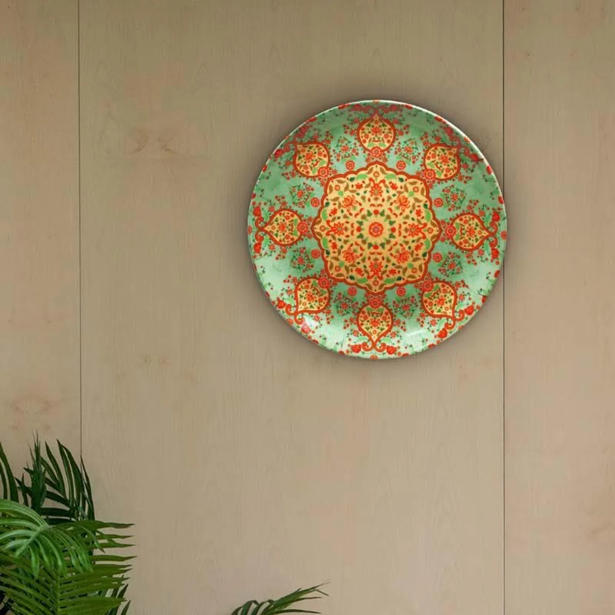 Round green mandala decorative plate mounted on a wall