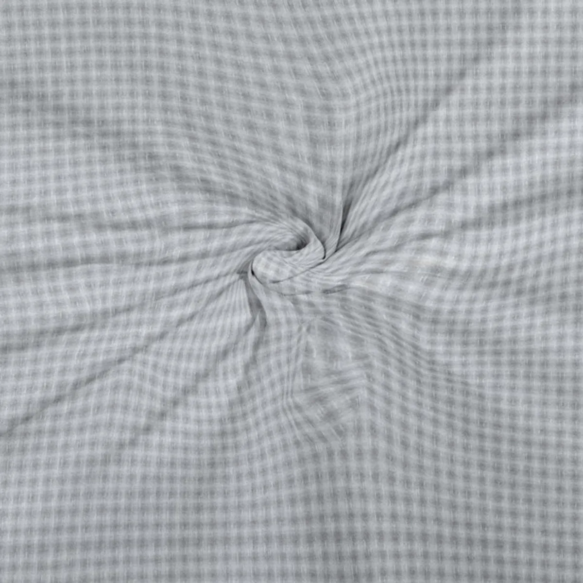 Close-up showing the grey textured reverse side of the bedsheet