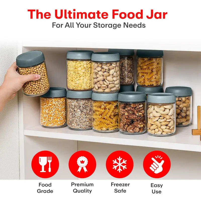 Clear storage jars filled with pantry foods arranged on a kitchen shelf.