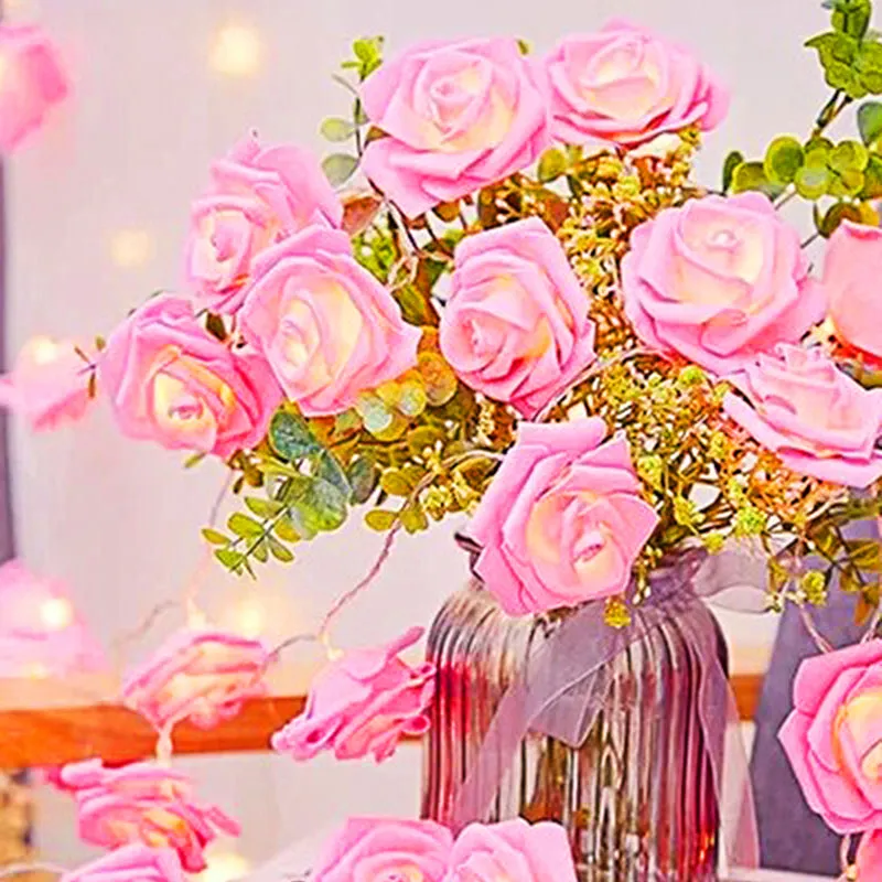 Pink rose string lights styled around a vase of flowers