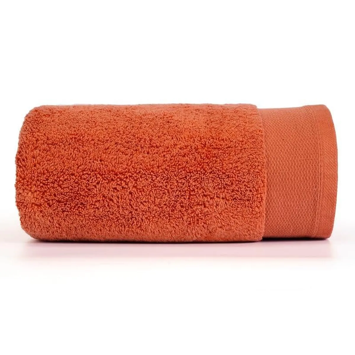 Rolled orange bath towel displayed on a white background