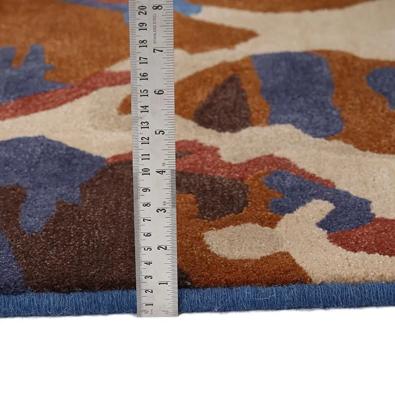 Close-up of carpet edge and pile with ruler placed on top