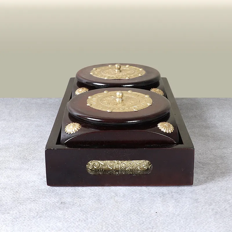 Top view of an open brown container with two round compartments and lids
