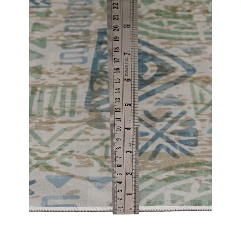 Close-up of the carpet edge with a ruler beside it