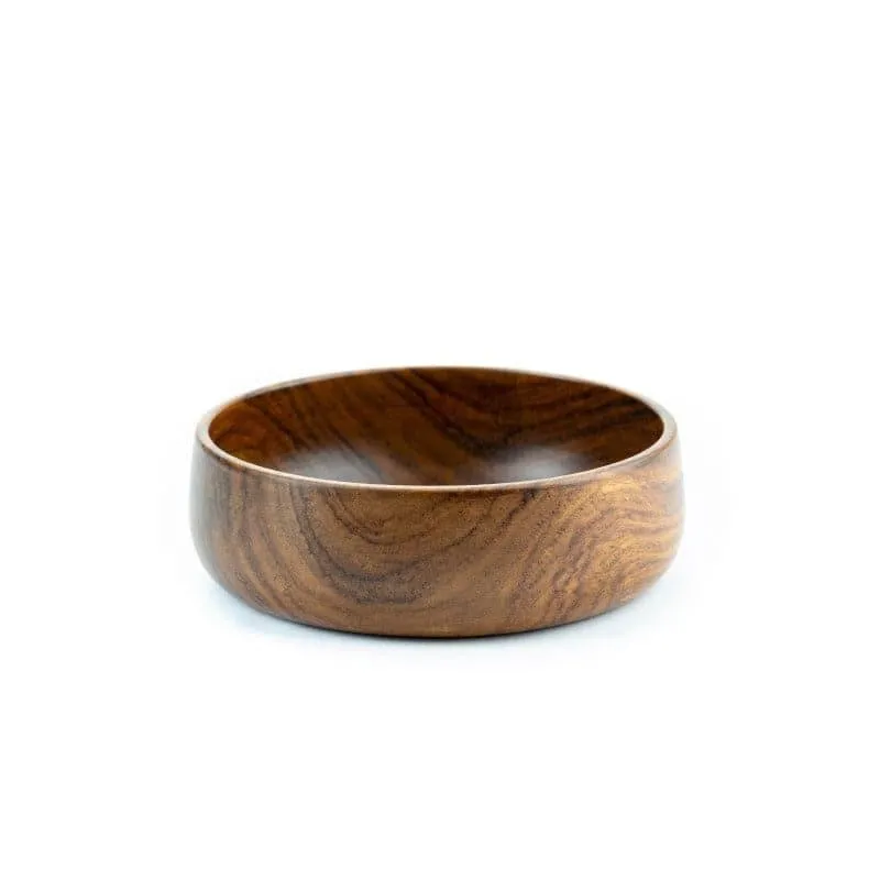 Round brown wooden serving bowl with visible wood grain