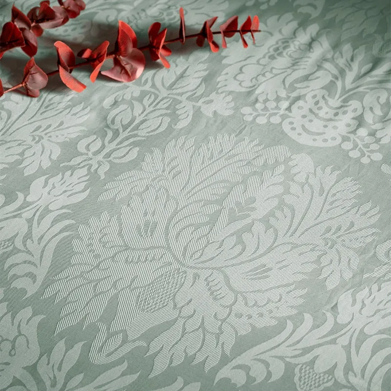 Close-up of sage green floral jacquard fabric