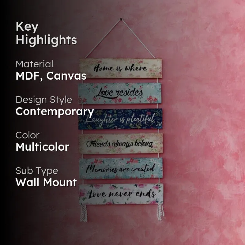 Lifestyle view of the multicolour message wall hanging against a pink background