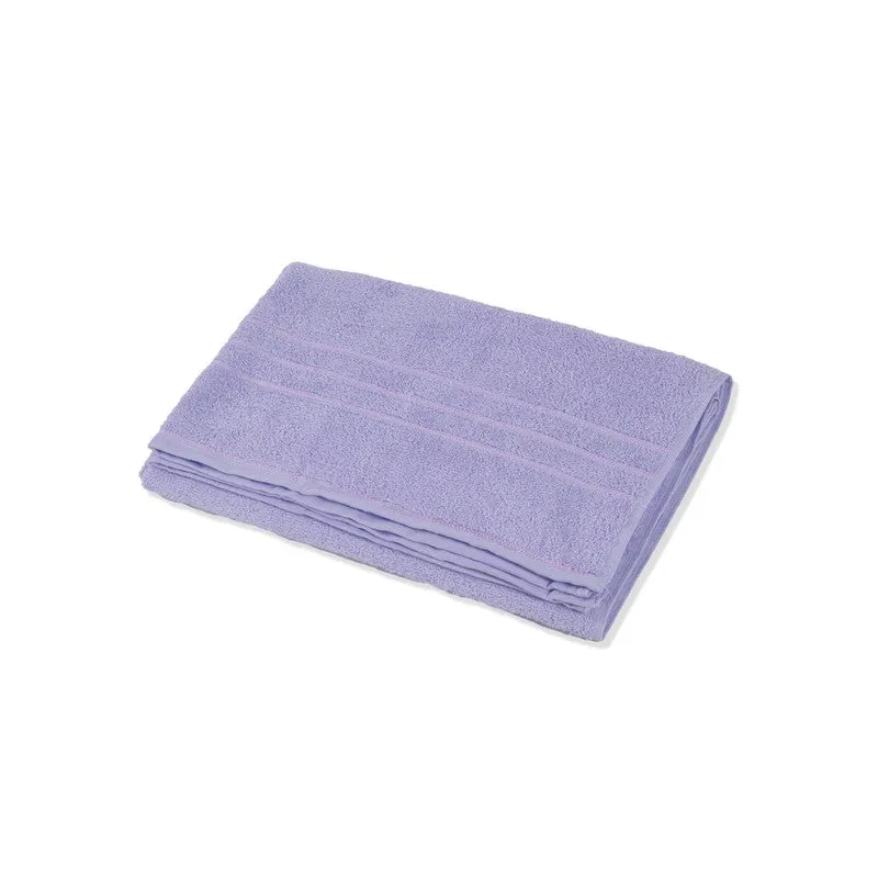 Folded lavender bath towel on a white background