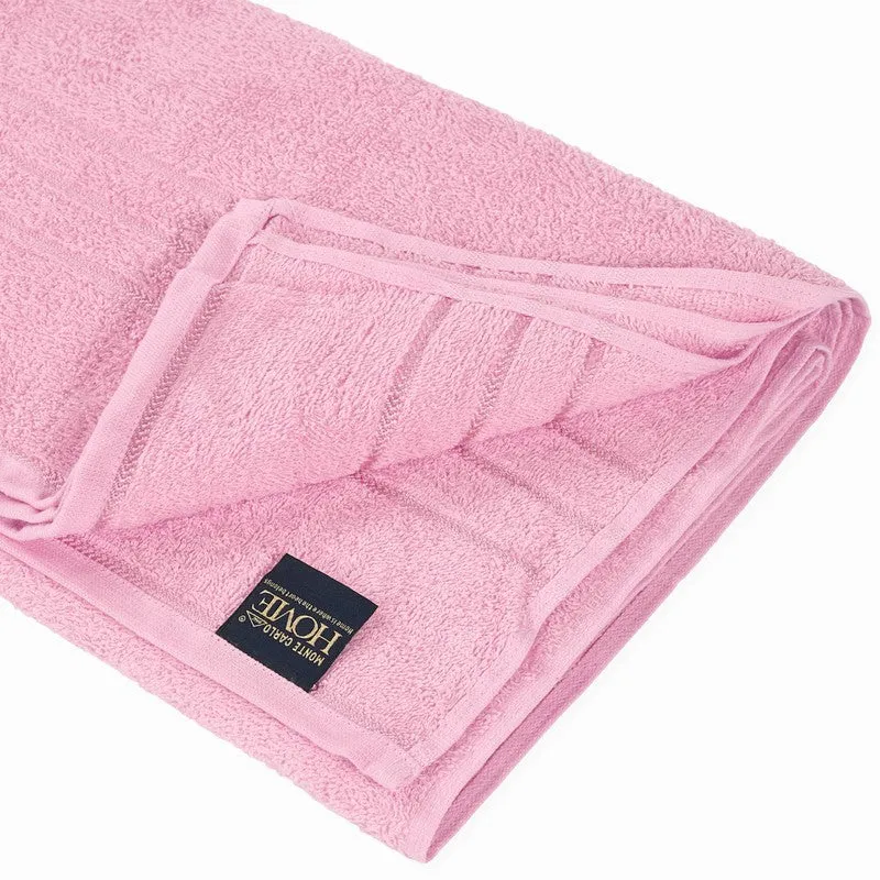 Close-up of the folded light pink cotton bath towel edge