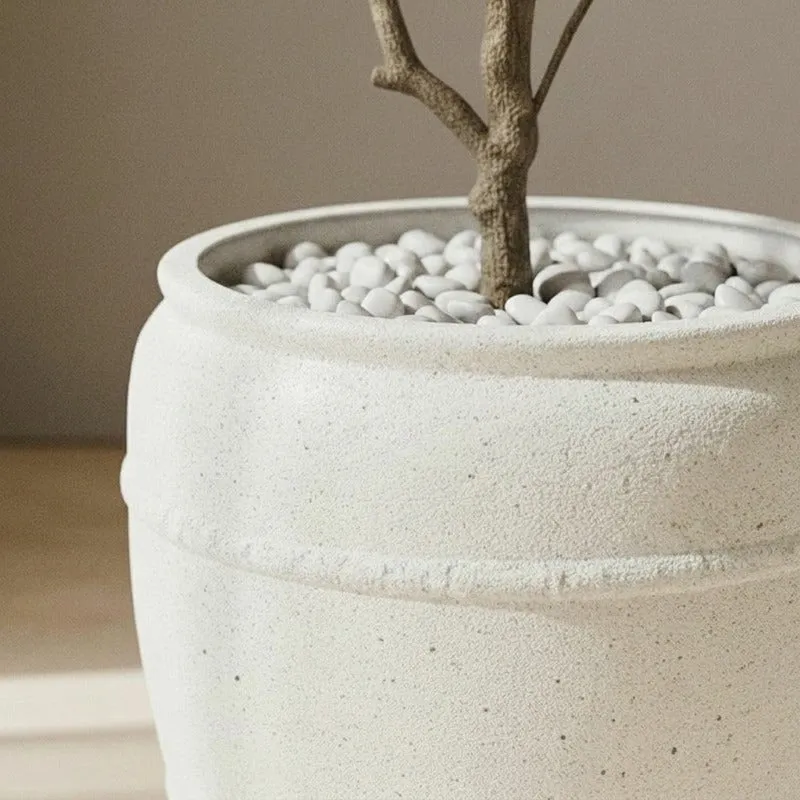 Close-up of the off-white planter rim and textured speckled surface