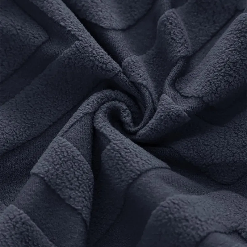Close-up of black textured jacquard fabric with geometric pattern