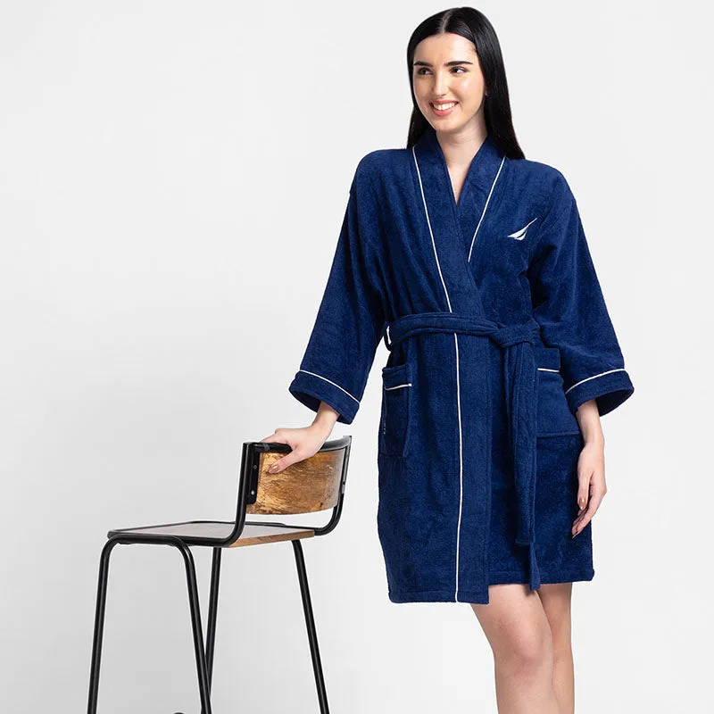 Front view of navy blue bath robe with white piping, belt and pockets