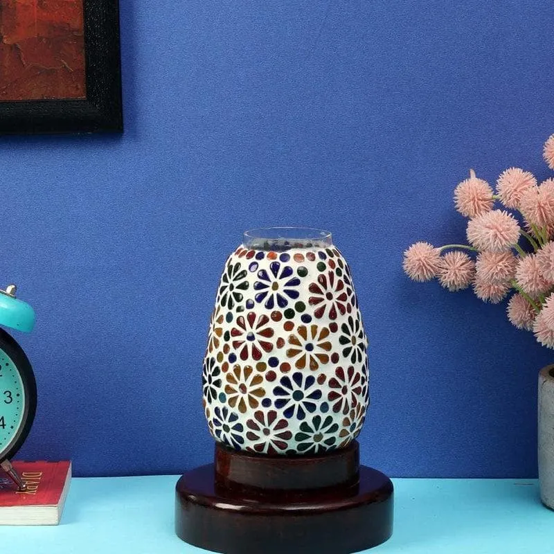 Unlit floral glass table lamp styled on a tabletop
