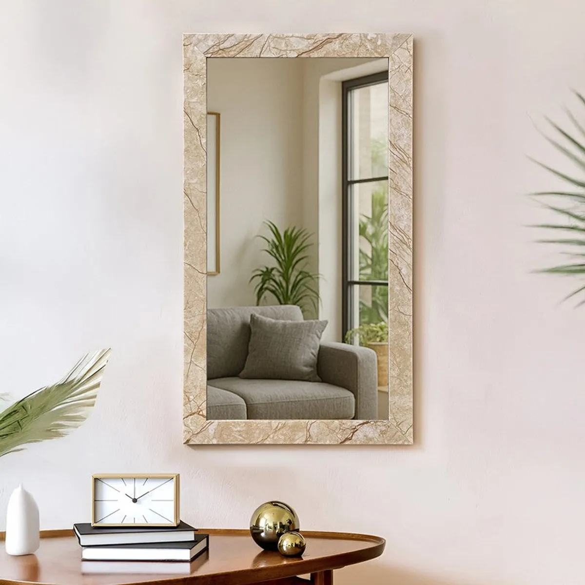 Rectangular beige marble-finish wall mirror styled above a console table