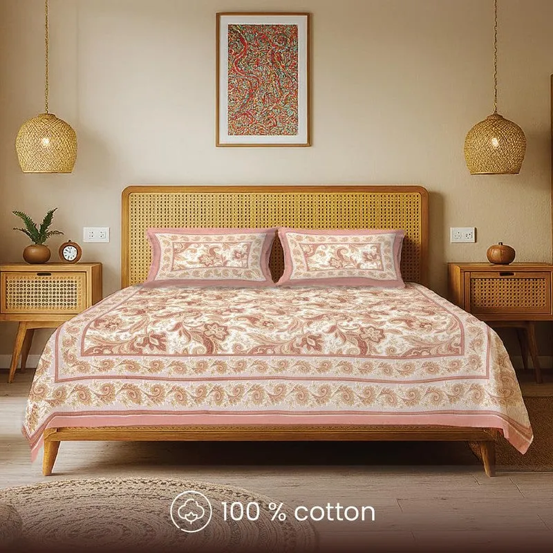 Front view of pink and cream patterned bedsheet with matching pillow covers