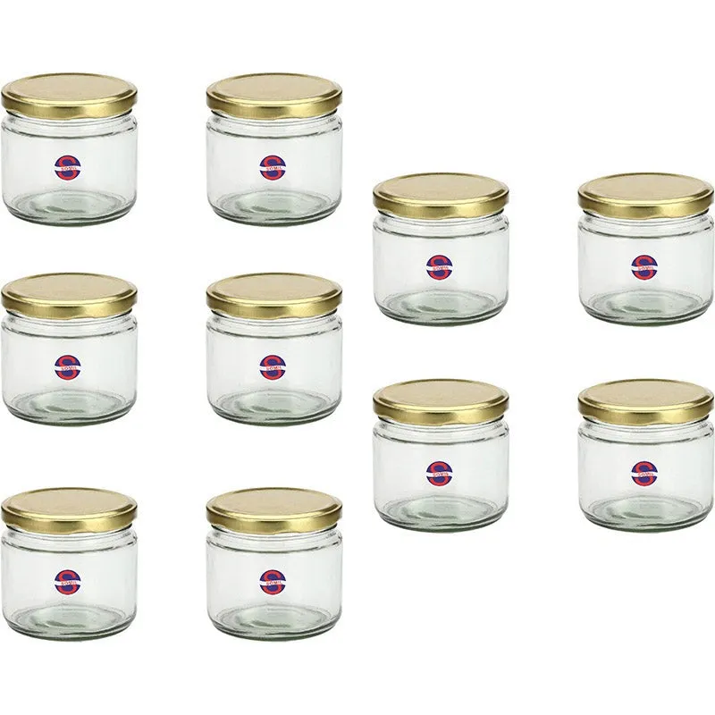 Ten empty transparent glass jars with gold lids arranged in rows.