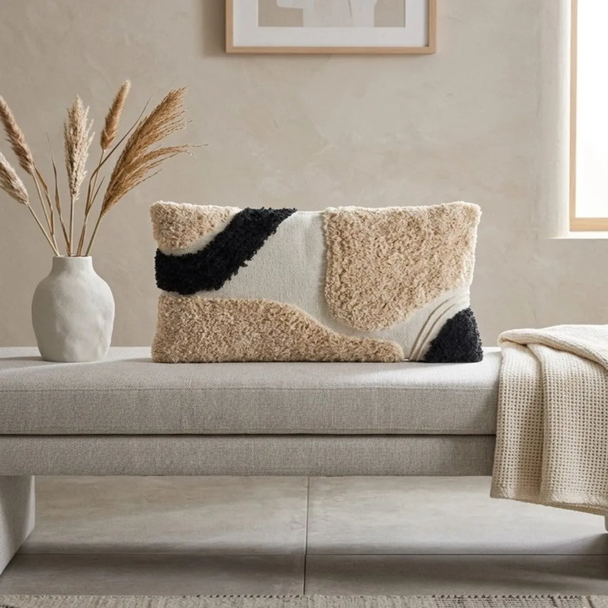 Rectangular tufted cushion cover displayed on a light sofa beside a throw