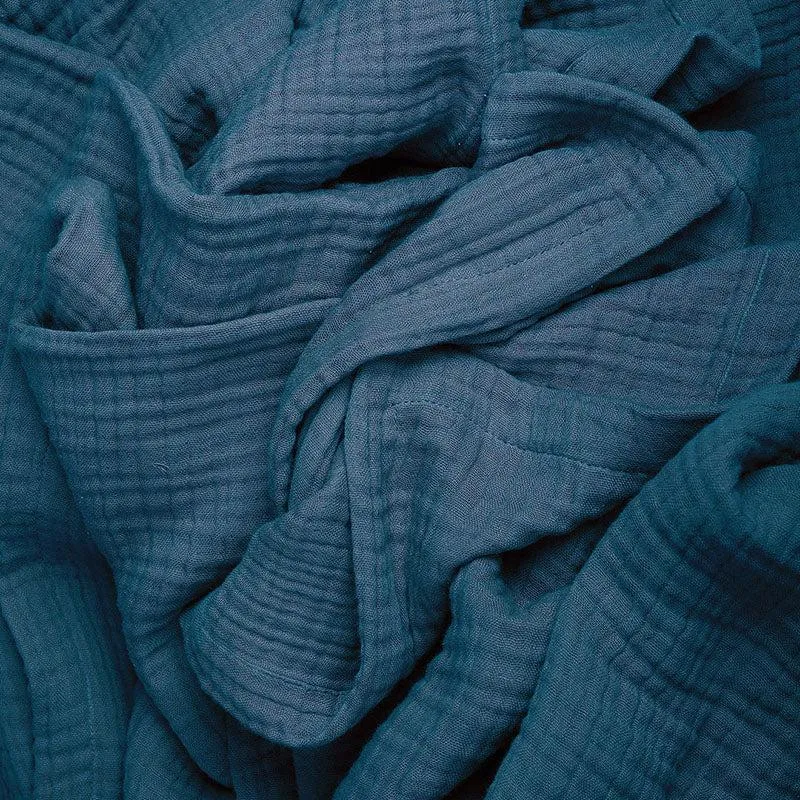 Close-up of the navy blue crinkle-textured bedding fabric