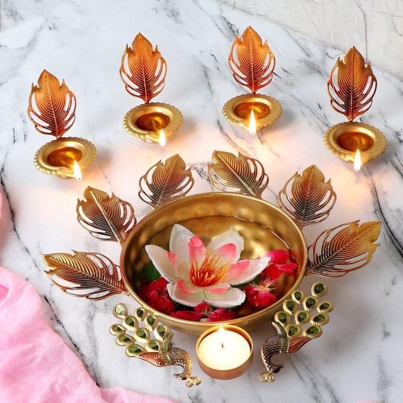 Mayoora Mena Urli with Diya