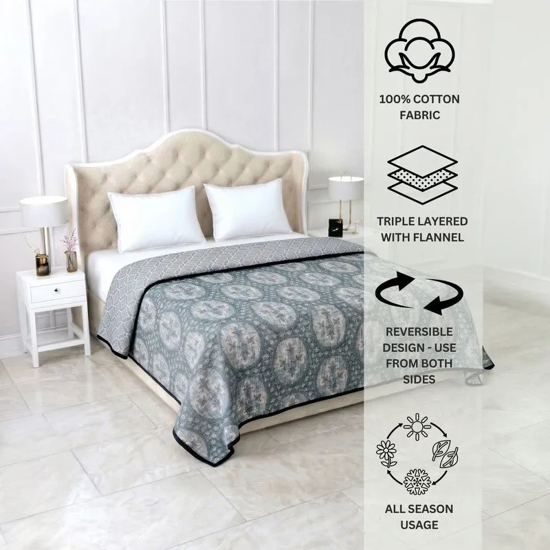 Blue reversible dohar styled on a bed