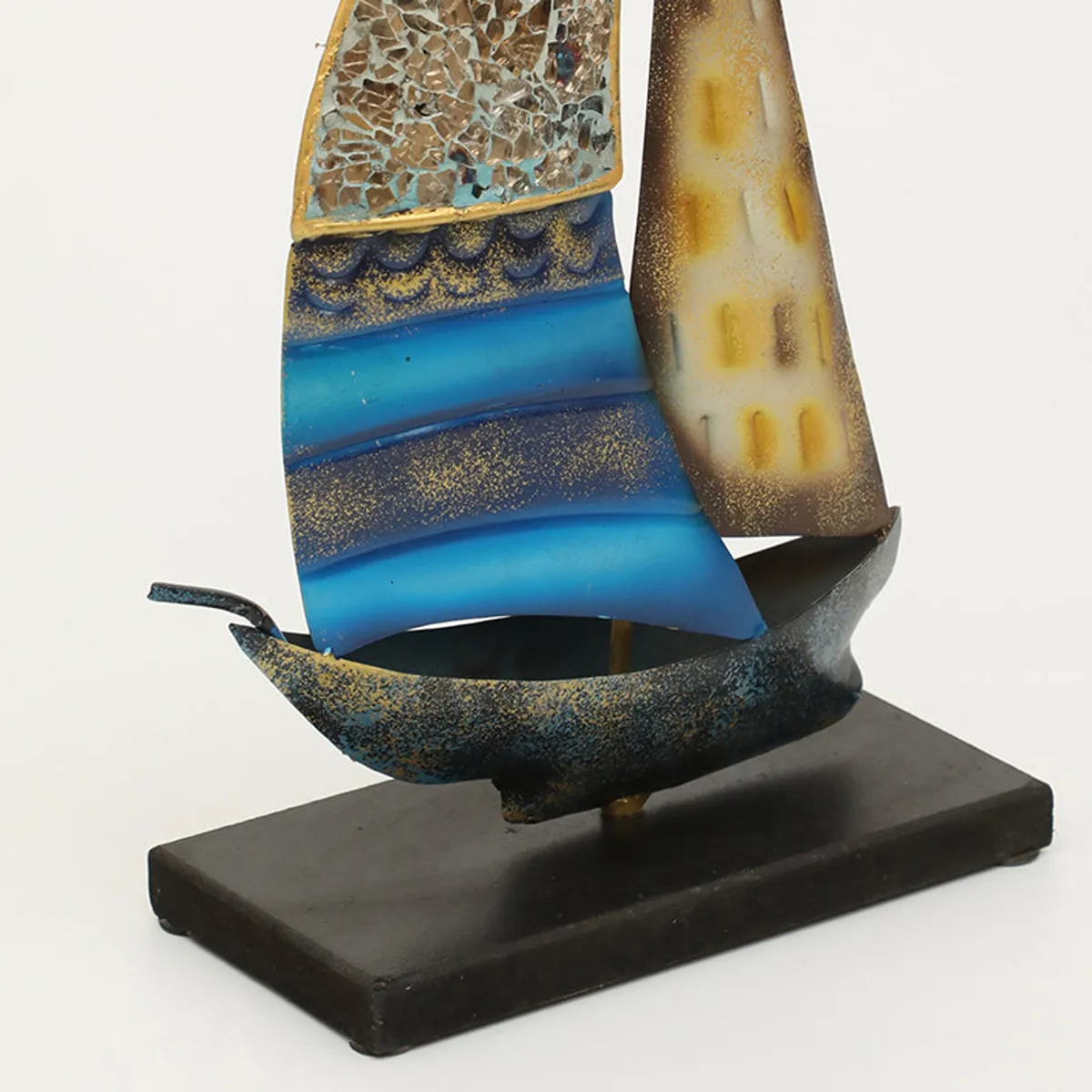 Close-up of the lower half of the sailboat showpiece on its base