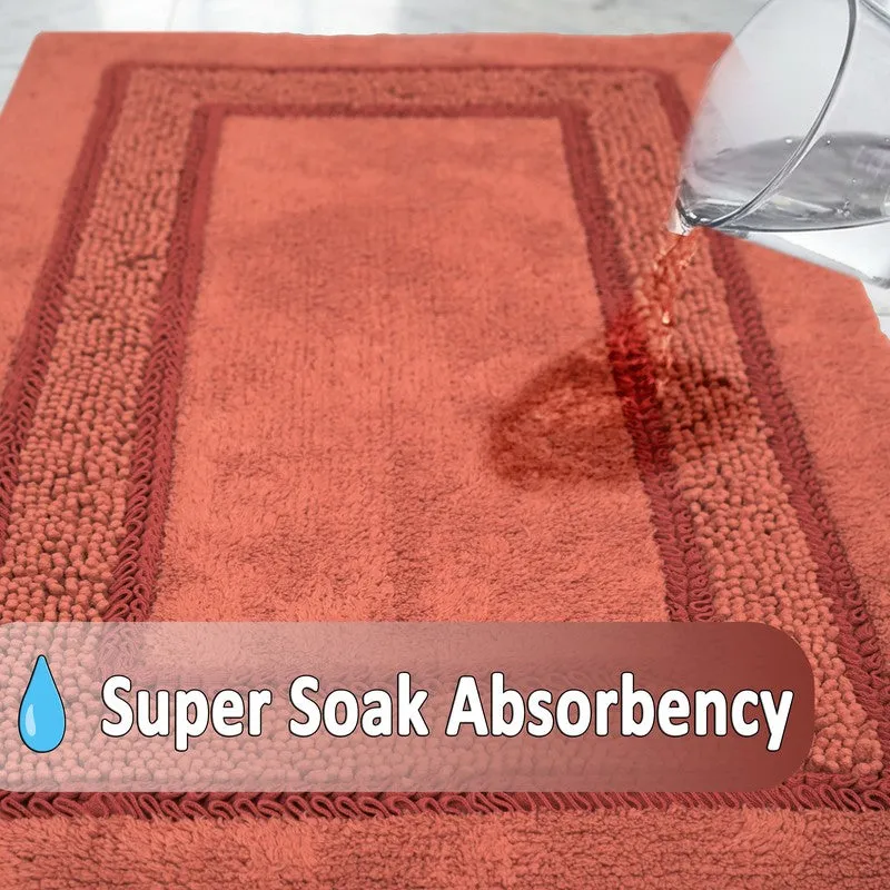 Water poured onto the orange bath mat to show its absorbent surface