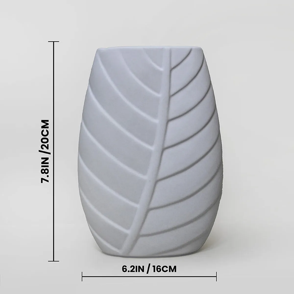 White embossed leaf-pattern vase shown with printed size markers