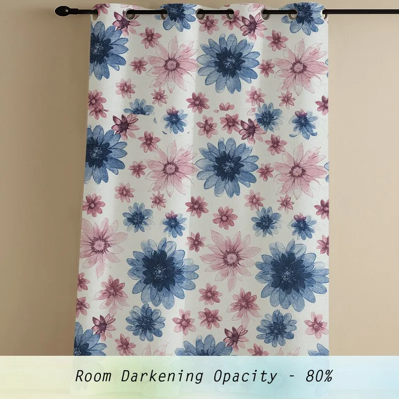 Single blue and pink floral curtain shown hanging from a rod.