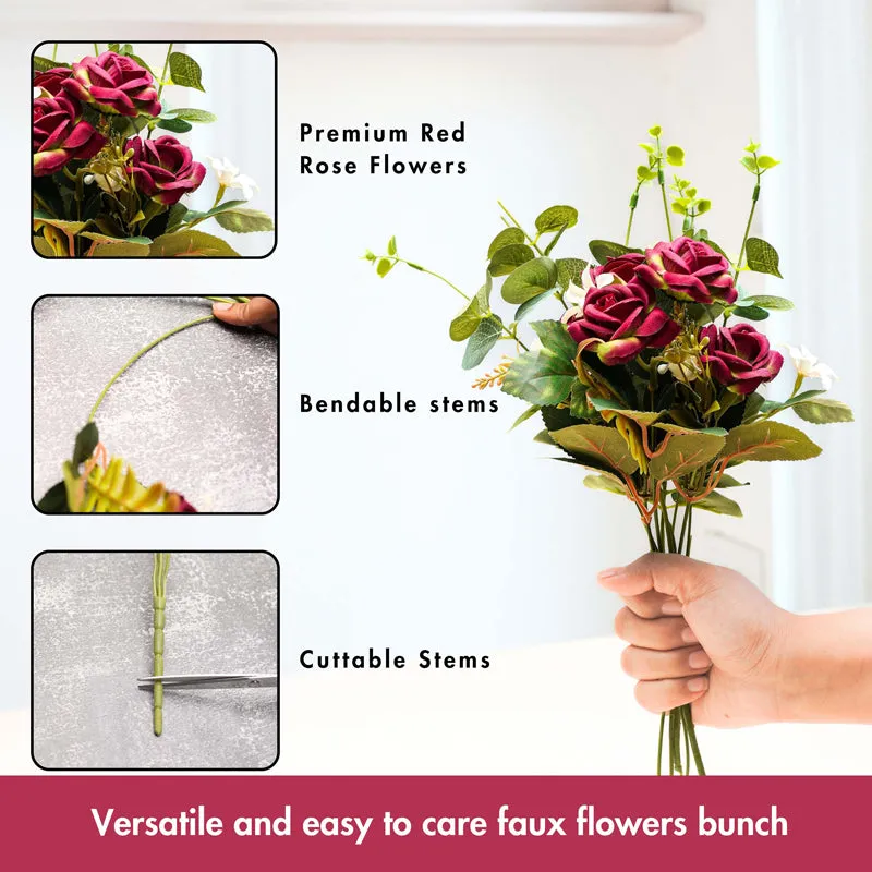 Hand holding an artificial rose bouquet with green stems and foliage